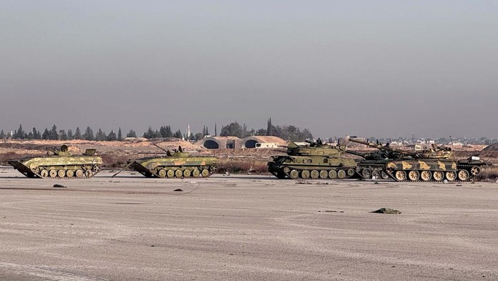 Abandoned tanks stand at a military airport in the suburb of Mezzeh where many Syrians died in detention, killed by execution, torture or maltreatment at the site that was widely feared, according to a report shared exclusively with Reuters by the Syria Justice and Accountability Centre tracing the deaths to seven suspected grave sites, on the outskirts of Damascus, Syria, December 20, 2024. REUTERS/Maggie Michael