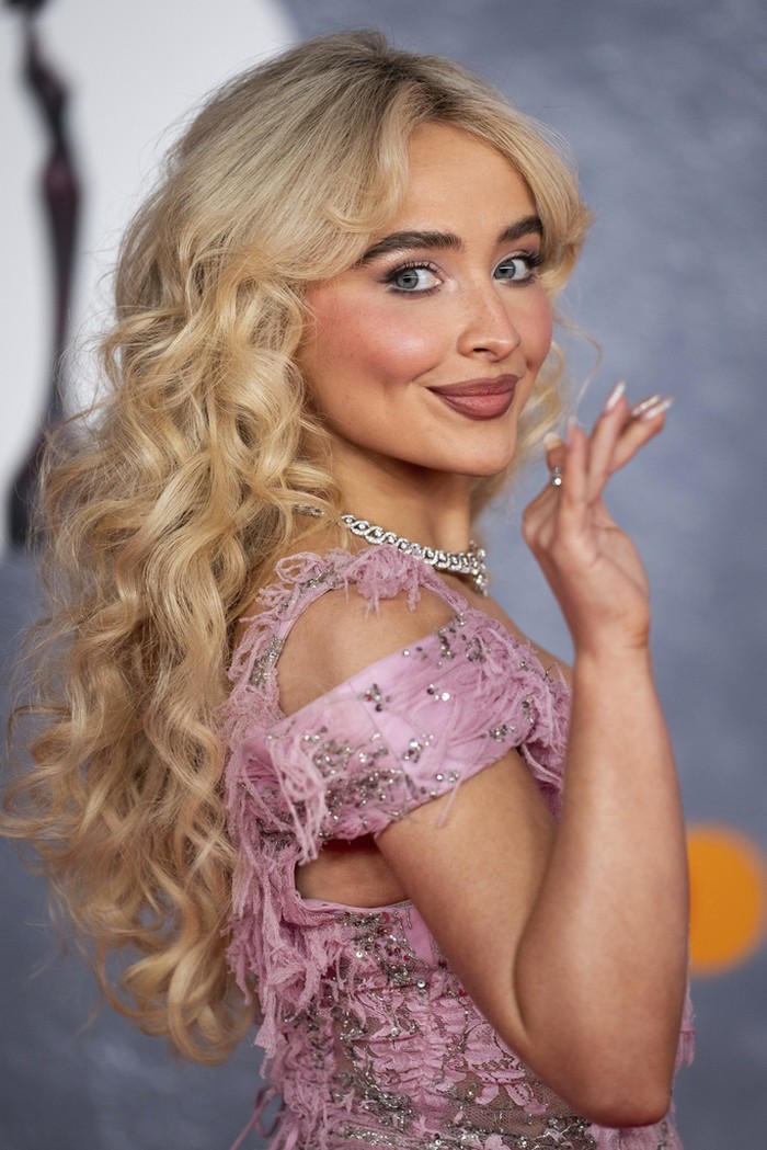 Sabrina Carpenter poses for photographers upon arrival at the Brit Awards 2025 in London, Saturday, March. 1, 2025. (Photo by Scott A Garfitt/Invision/AP)