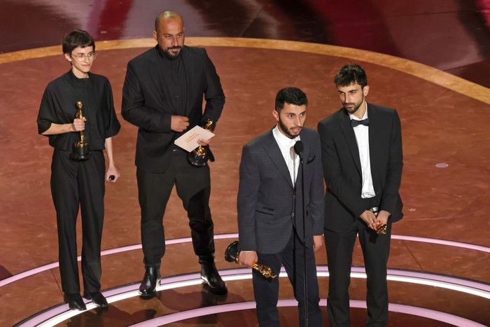 HOLLYWOOD, CALIFORNIA - MARCH 02: (L-R) Rachel Szor, Hamdan Ballal, Basel Adra and Yuval Abraham accept the Documentary Feature Film award No Other Land onstage during the 97th Annual Oscars at Dolby Theatre on March 02, 2025 in Hollywood, California.  (Photo by Kevin Winter/Getty Images)