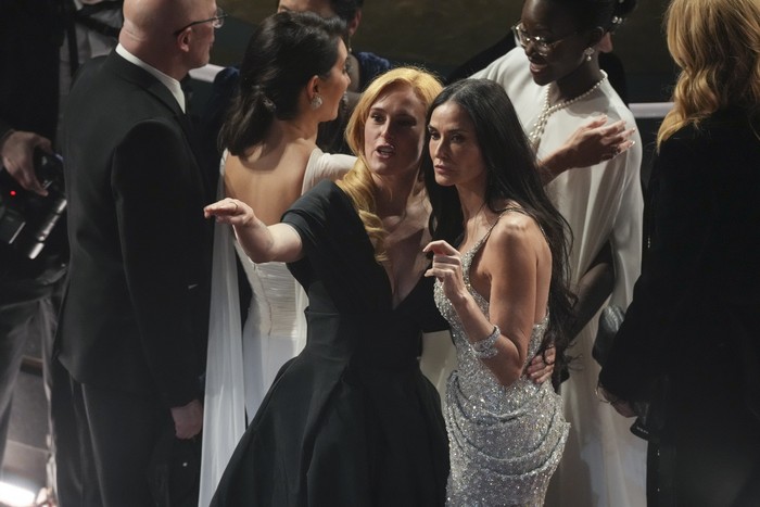 Rumer Willis, left, and Demi Moore appear in the audience during the Oscars on Sunday, March 2, 2025, at the Dolby Theatre in Los Angeles. (AP Photo/Chris Pizzello)