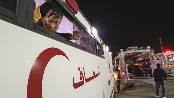 A Palestinian boy injured in the Israeli military's ground and air offensive on Gaza, sits in an ambulance as the first group of sick Gaza children arrives in Jordan for medical treatment at the King Hussein Bridge border crossing on Tuesday, March 4, 2025. (AP Photo/Raad Adayleh)