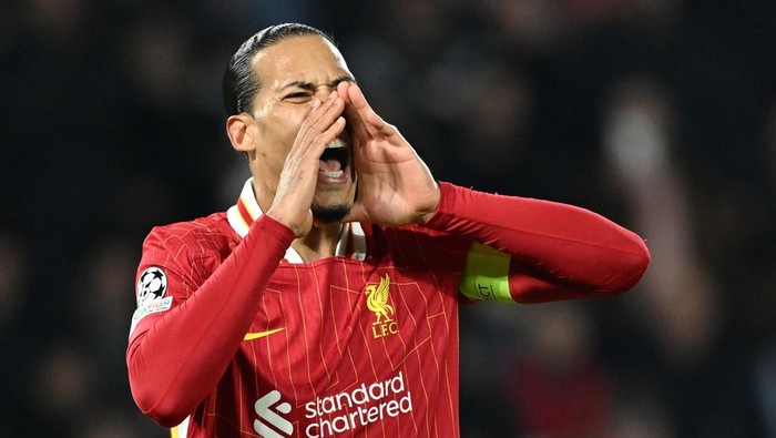 PARIS, FRANCE - MARCH 05: Virgil Van Dijk of Liverpool FC reacts during the UEFA Champions League Round of 16 first leg football match between Paris Saint-Germain and Liverpool at Parc des Princes Stadium in Paris, France on March 05, 2025. (Photo by Mustafa Yalcin/Anadolu via Getty Images)