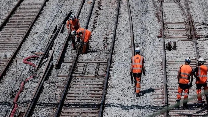 Employees work on the renovation and modernisation of train tracks at Paris’ Gare du Nord, Europe’s busiest train station and the third in the world, on May 11, 2024. (AFP)