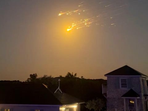 A view shows debris streaking through the sky, after SpaceX's Starship spacecraft tumbled and exploded in space, in Big Sampson Kay, Bahamas, March 6, 2025, in this screen grab obtained from social media video. @_ericloosen_/via REUTERS Purchase Licensing Rights