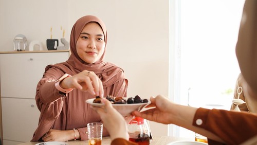 Asian muslim people eating and drinking together when breakfasting time