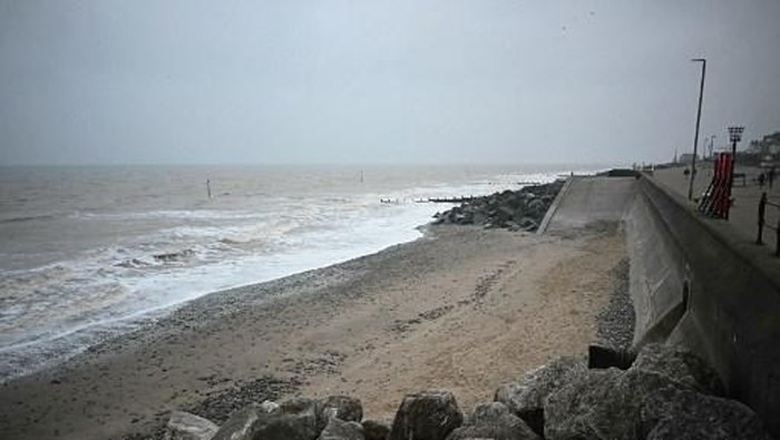 Waves roll onto the beach from the North Sea in Withernsea, on the east coast of England on March 10, 2025. The US operator of the Stena Immaculate, an oil tanker hit by a cargo ship in the North Sea, off the coast of Withernsea on Monday said its crew had abandoned the tanker after a fuel leak and multiple explosions. 