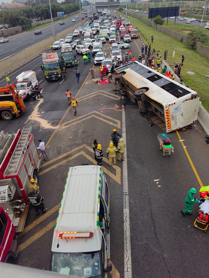 Emergency personnel work at the scene of a fatal bus crash near O.R. Tambo International Airport, in Ekurhuleni, East of Johannesburg, South Africa, March 11, 2025. William Tladi/City of Joburg EMS/Handout via REUTERS    THIS IMAGE HAS BEEN SUPPLIED BY A THIRD PARTY. MANDATORY CREDIT.