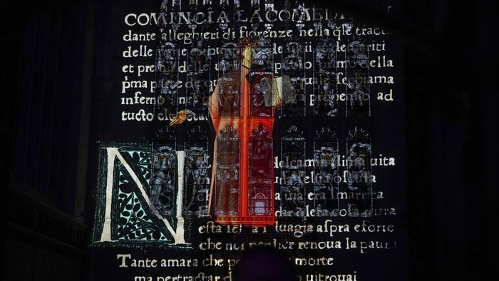 A sound and light show with a literary theme developed by Luxmuralis is screened inside Winchester Cathedral in Winchester, England, Tuesday, March 11, 2025. (AP Photo/Alastair Grant)