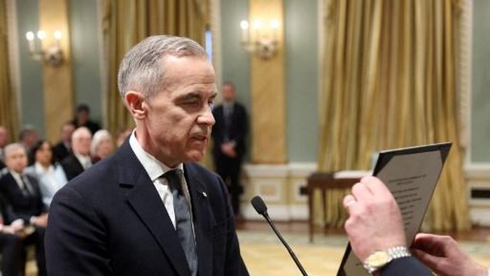 Canadas Prime Minister designate Mark Carney (L) and Clerk of the Privy Council John Hannaford prepare for Carneys swearing in ceremony at Rideau Hall on March 14, 2025, in Ottawa, Canada. (Photo by Dave Chan / AFP)