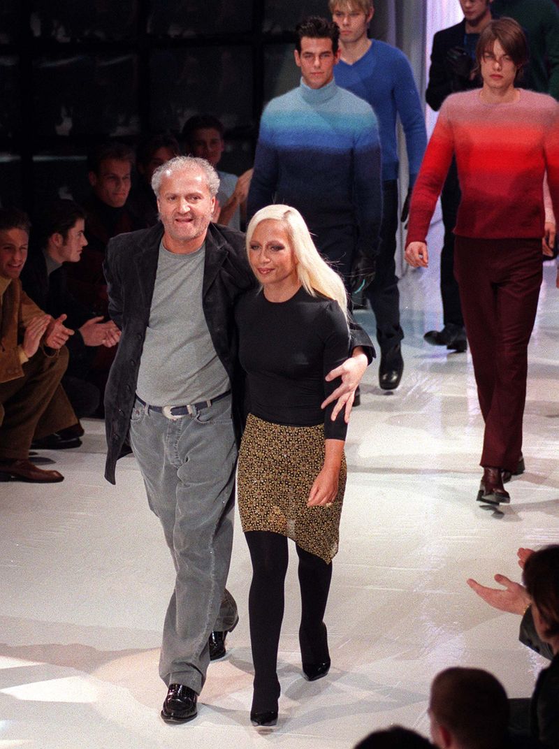 **FOR USE WITH AP LIFESTYLES**   **FILE**   This Jan. 12, 1997 file photo shows Italian fashion designer Gianni Versace and his sister Donatella as they acknowledge the audience, at the end of the Gianni Versace men's fashion collection, presented in Milan.       (AP Photo/Antonio Calanni, FILE)
