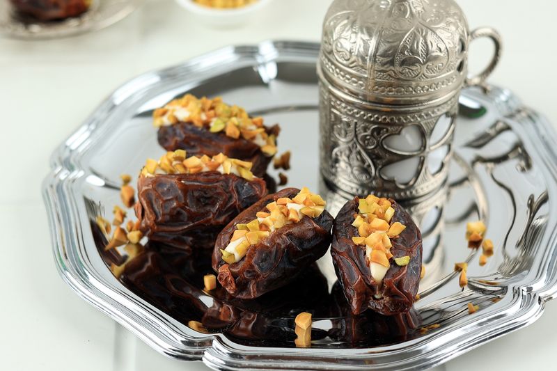 Dates Stuffed with Cream Cheese, Peanut Butter, and Pistachios. Served with Tea