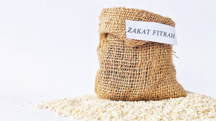 Rice grains in a burlap sack for zakat, the Islamic concept of zakat in the holy month of Ramadan