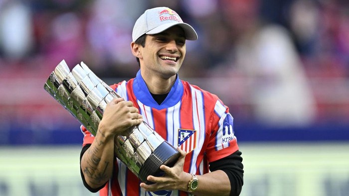 MADRID, SPAIN - DECEMBER 15: MotoGP 2024 season World Champion Spanish Jorge Martin presents the MotoGP World Championship Trophy prior the La Liga week 17 football match between Atletico Madrid and Getafe at the Riyadh Air Metropolitano Stadium in Madrid, Spain on December 15, 2024. (Photo by Burak Akbulut/Anadolu via Getty Images)