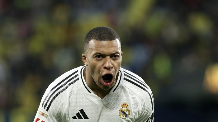 Real Madrids Kylian Mbappe celebrates after scoring his sides second goal during a Spanish La Liga soccer match between Villarreal and Real Madrid in Villarreal, Spain, Saturday, March 15, 2025. (AP Photo/Alberto Saiz)