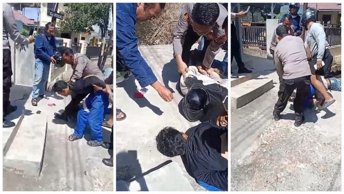 Tangkap layar video saat dua pemuda bertransaksi narkoba di depan kantor polisi.