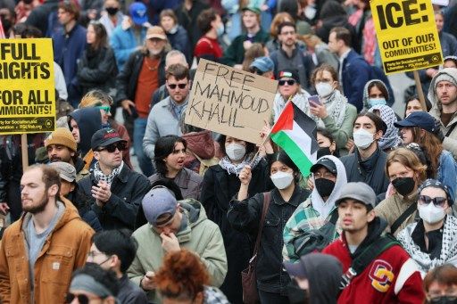  People gather outside of a New York court to protest the arrest and detention of Mahmoud Khalil at Foley Square on March 12, 2025 in New York City. A federal judge in New York heard arguments for and against the detention of Khalil, a permanent U.S. resident, green card holder and recent Columbia graduate, who is married to an American citizen, who played a role in pro-Palestinian protests at Columbia University. He was arrested by federal immigration agents in New York City and was subsequently transferred to a facility in Jena, Louisiana, where he is being held. The Trump administration is seeking to deport him over his participation in pro-Palestinian protests at the school. Michael M. Santiago/Getty Images/AFP (Photo by Michael M. Santiago / GETTY IMAGES NORTH AMERICA / Getty Images via AFP)