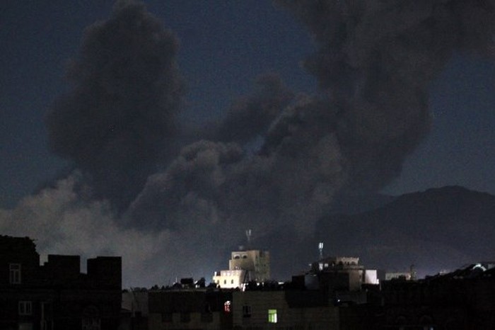 A plume of smoke billows during a US strike on Yemens Huthi-held capital Sanaa early on March 16, 2025. The first US strikes against Yemens Huthis since President Donald Trump took office in January killed at least 31 people, the rebels said on March 16, as Washington warned Iran to stop backing the group. (Photo by Mohammed HUWAIS / AFP)