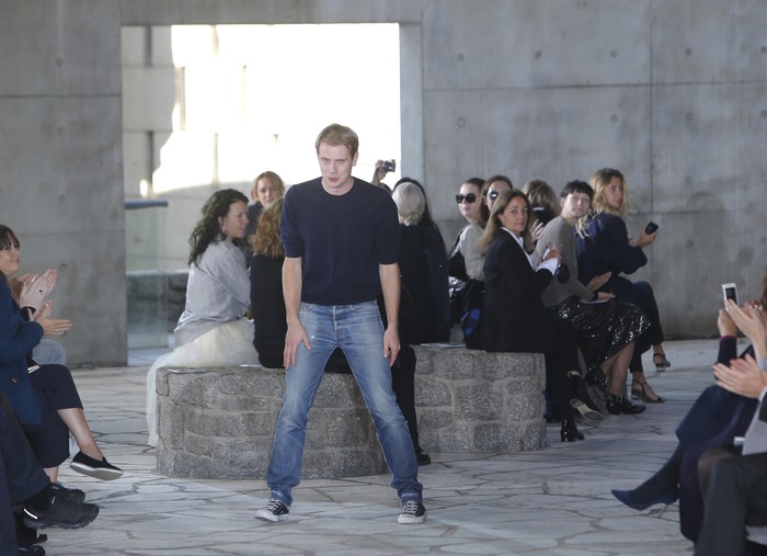British fashion designer Jonathan William Anderson acknowledges applause after the presentation of Loewes Spring/Summer 2015 ready-to-wear fashion collection presented in Paris, France, Friday, Sept. 26, 2014. (AP Photo/Thibault Camus)