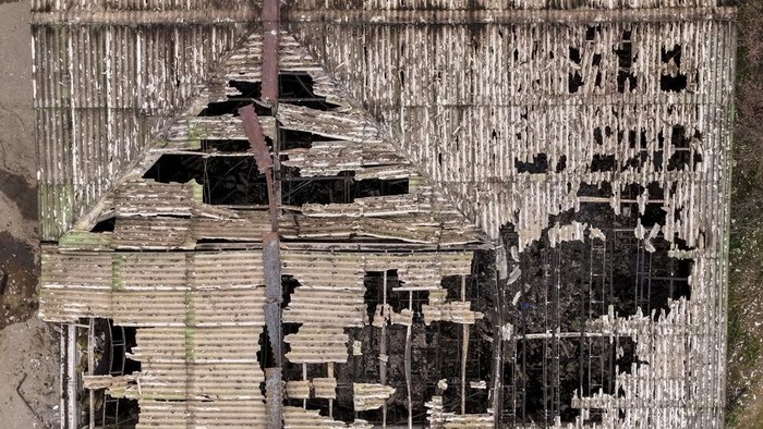 An aerial photograph shows the damaged roof of a nightclub in the town of Kocani, North Macedonia, Sunday, March 16, 2025, following a massive fire in the nightclub early Sunday. (AP Photo/Armin Durgut)