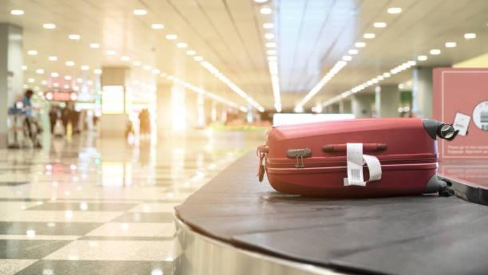 Luggage On Conveyor Belt At Airport
