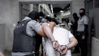 Para tahanan dipindahkan ke penjara besar yang terkenal di El Salvador, Pusat Penahanan Terorisme atau Terrorism Confinement Center (Cecot).