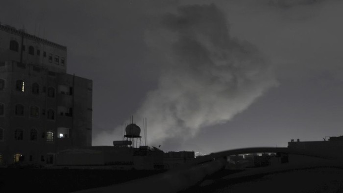 Smoke rises from a location reportedly struck by U.S. airstrikes in Sanaa, Yemen, Saturday, March 15, 2025. (AP Photo/Osamah Abdulrahman