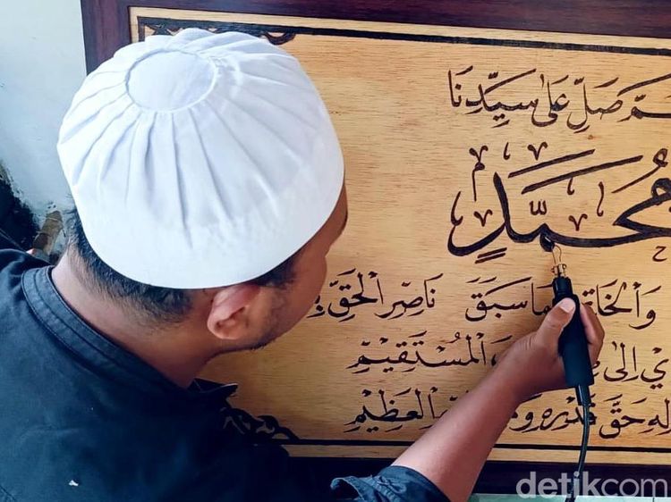Raup Cuan dari Kaligrafi Lukis Bakar