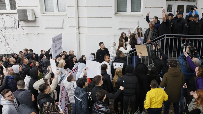 Residents gather in front of the mayor's office during a protest following a massive nightclub fire in the town of Kocani, North Macedonia, Monday, March 17, 2025. (AP Photo/Boris Grdanoski)