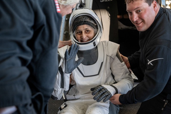 Support teams onboard the SpaceX recovery ship MEGAN work around a SpaceX Dragon spacecraft shortly after it landed with NASA astronauts Nick Hague, Suni Williams, Butch Wilmore, and Roscosmos cosmonaut Aleksandr Gorbunov aboard in the water off the coast of Tallahassee, Florida, Tuesday, March 18, 2025. NASA/Keegan Barber/ Handout via REUTERS