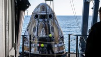 Support teams onboard the SpaceX recovery ship MEGAN work around a SpaceX Dragon spacecraft shortly after it landed with NASA astronauts Nick Hague, Suni Williams, Butch Wilmore, and Roscosmos cosmonaut Aleksandr Gorbunov aboard in the water off the coast of Tallahassee, Florida, Tuesday, March 18, 2025. NASA/Keegan Barber/ Handout via REUTERS