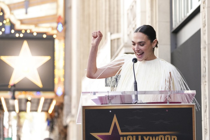 Jaron Varsano, left, and Gal Gadot pose atop Gadot's new star at a ceremony on the Hollywood Walk of Fame on Tuesday, March 18, 2025, in Los Angeles. (Photo by Jordan Strauss/Invision/AP)