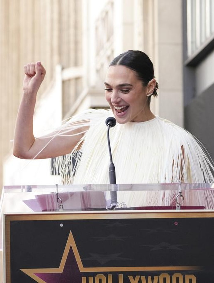 Jaron Varsano, left, and Gal Gadot pose atop Gadots new star at a ceremony on the Hollywood Walk of Fame on Tuesday, March 18, 2025, in Los Angeles. (Photo by Jordan Strauss/Invision/AP)