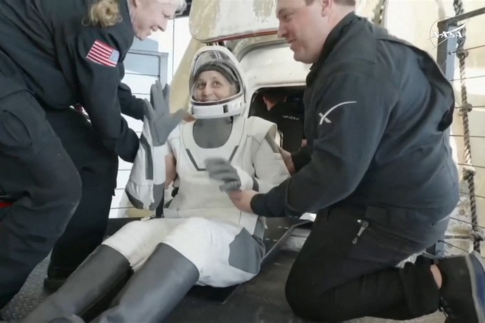 Suni Williams reacts as she is helped to leave a Crew Dragon space capsule after she and Butch Wilmore, and two other astronauts, splashed down following their return to earth from the International Space Station off the coast of Florida, U.S. March 18, 2025 in a still image from video.  NASA TV/Handout via REUTERS.  THIS IMAGE HAS BEEN SUPPLIED BY A THIRD PARTY