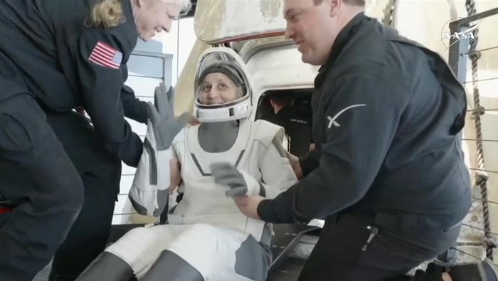Suni Williams reacts as she is helped to leave a Crew Dragon space capsule after she and Butch Wilmore, and two other astronauts, splashed down following their return to earth from the International Space Station off the coast of Florida, U.S. March 18, 2025 in a still image from video.  NASA TV/Handout via REUTERS.  THIS IMAGE HAS BEEN SUPPLIED BY A THIRD PARTY