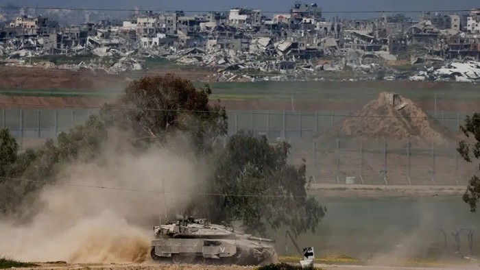 An Israeli tank maneuvers on the Israeli side of the border between Israel and Gaza, March 18, 2025. (Reuters)