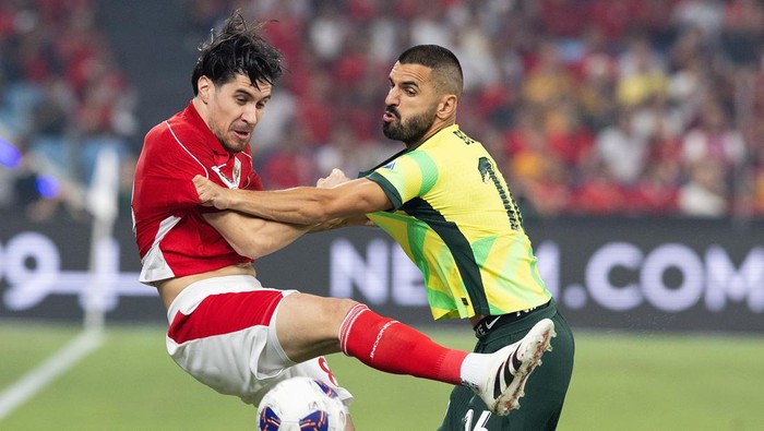 SYDNEY, AUSTRALIA - MARCH 20: Aziz Behich of Australia challenges Indonesias Kevin Diks for the ball during  up before the round three FIFA 2026 World Cup AFC Asian Qualifier match between Australia Socceroos and Indonesia at Allianz Stadium on March 20, 2025 in Sydney, Australia. (Photo by Steve Christo - Corbis/Corbis via Getty Images)