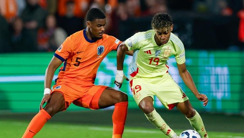 Rotterdam, Netherlands - March 20: Lamine Yamal of Spain dribbles with the ball, defends by Jorrel Hato of Netherlands during the UEFA Nations League quarterfinal leg one match between Netherlands and Spain at De Kuip on March 20, 2025 in Rotterdam, Netherlands. (Photo by Marcel ter Bals/DeFodi Images/DeFodi via Getty Images)