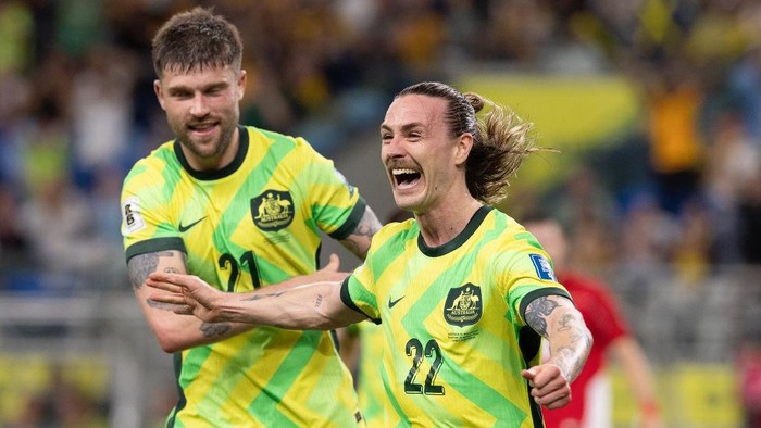 SYDNEY, AUSTRALIA - MARCH 20: Jackson Irvine of Australia celebrates his second goal with teammate Cameron Burgess during the round three FIFA 2026 World Cup AFC Asian Qualifier match between Australia Socceroos and Indonesia at Allianz Stadium on March 20, 2025 in Sydney, Australia. (Photo by Steve Christo - Corbis/Corbis via Getty Images)