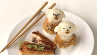 Kalau ini interpretasi Min Kyungjin dalam menyajikan bola-bola nasi bentuk boneka dan lauk ikan panggang. Foto: Instagram sibatable