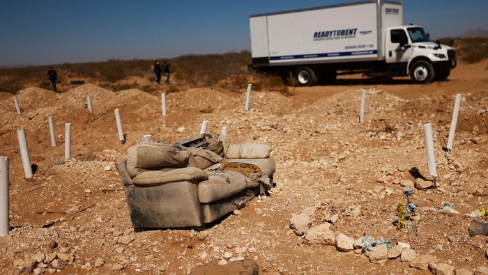 An armchair is seen during the mass burial of unidentified bodies, victims of violence and social abandonment, in a mass grave at the San Rafael cemetery, in Ciudad Juarez, Mexico, March 21, 2025. REUTERS/Jose Luis Gonzalez