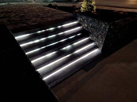 stairs on the square or on the route.  building terrace with backlight. light led strip. light tubes illuminate the bottom of the stairs so that people don't trip over when they go at night, underpath, included, dance club, disco, cabaret