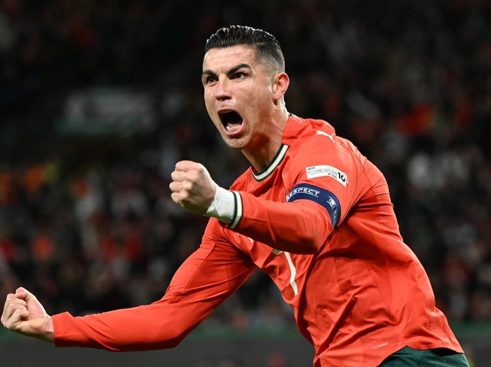 LISBON, PORTUGAL - MARCH 23: Cristiano Ronaldo of Portugal celebrates after scoring a goal during the UEFA Nations League Quarterfinal Leg Two match between Portugal and Denmark at Estadio Jose Alvalade on March 23, 2025 in Lisbon, Portugal. (Photo by Zed Jameson/MB Media/Getty Images)