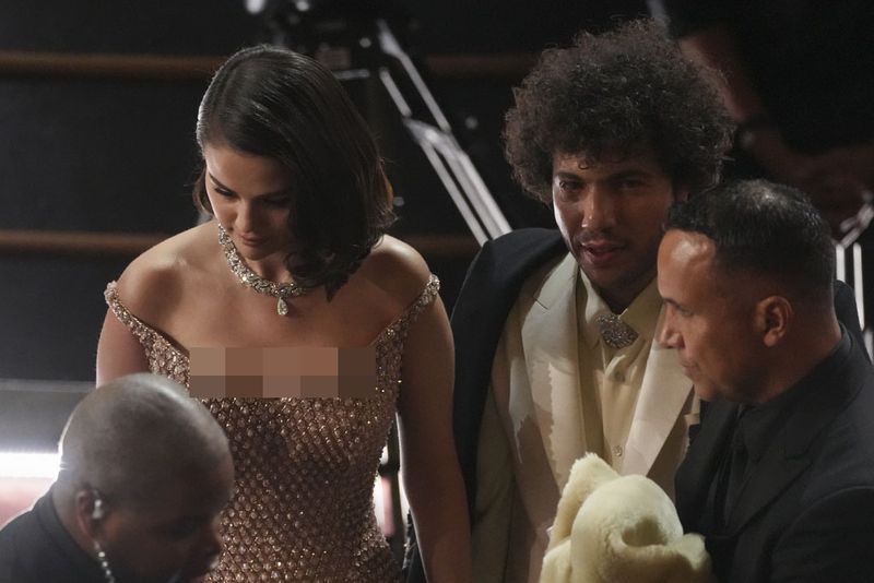 Selena Gomez, left, and Benny Blanco in the audience during the Oscars on Sunday, March 2, 2025, at the Dolby Theatre in Los Angeles. (AP Photo/Chris Pizzello)