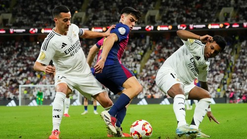 Pedri central midfield of Barcelona and Spain and Lucas Vazquez right winger of Real Madrid and SpaiN and Rodrygo Goes right winger of Real Madrid and Brazil compete for the ball during the Spanish Super Cup final match between Real Madrid and FC Barcelona at King Abdullah Sports City on January 12, 2025 in Jeddah, Saudi Arabia. (Photo by Jose Breton/Pics Action/NurPhoto via Getty Images)
