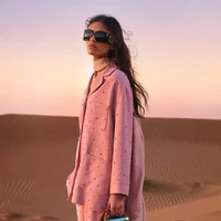 Merayakan keindahan Ramadan, Gucci memperkenalkan koleksi Nojum yang didominasi busana bersiluet ringan nan elegan hadir dalam setelan dua potong dan gaun mengalir bernuansa pink lembut, earthy tone hangat, serta biru malam yang kaya. Di jajaran aksesori, hadir tas ikonis Gucci Bamboo 1947, Jackie Notte, dan Gucci Diana dalam kulit berkilau, dipadukan dengan loafer Horsebit dan sling-back Signoria untuk sentuhan klasik yang menawan. (Foto: Dok. Gucci)