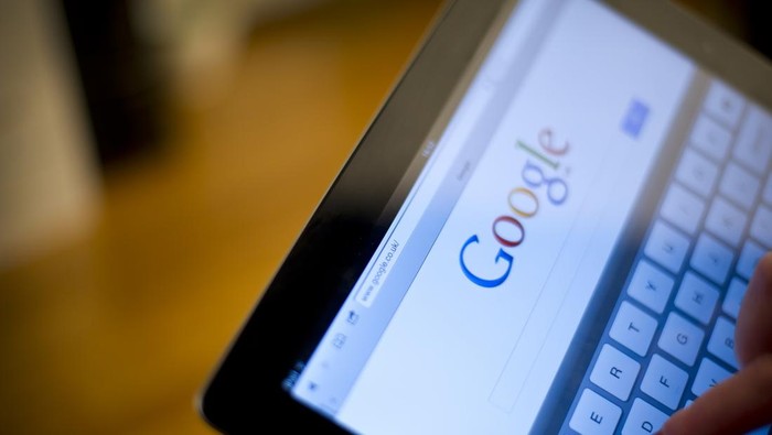 St.Helens, England - January 15th 2012: iPad2 in females hands displaying google search engine page. Google is one of the biggest search engines in the world. iPad2 was launched in March 2011.