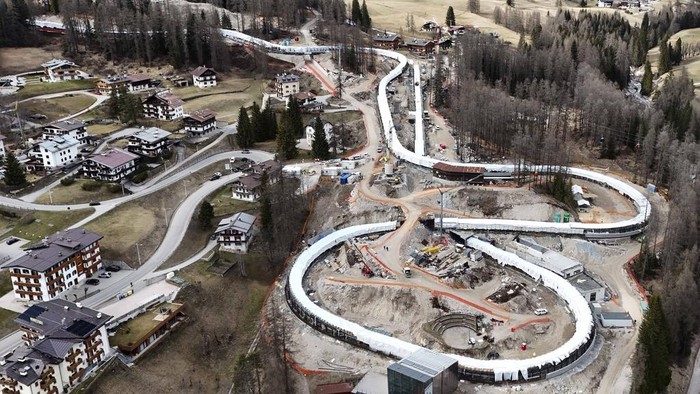 Construction work takes place at the Cortina Sliding Center, venue for the bob, luge and skeleton disciplines at the Milan Cortina 2026 Winter Olympics, in Cortina D'Ampezzo, Italy, Tuesday, March 25, 2025. (AP Photo/Luca Bruno)