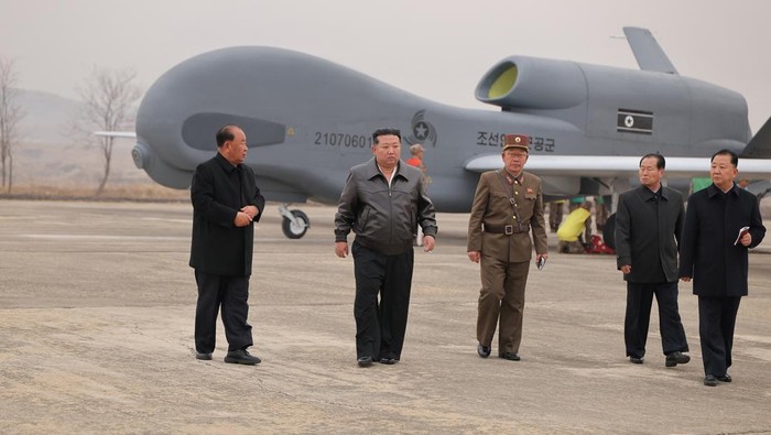 North Korean leader Kim Jong Un walks alongside officials, while guiding defense science research projects, according to local media, at an unknown location, in this photo released by North Koreas official Korean Central News Agency on March 27, 2025.    KCNA via REUTERS    ATTENTION EDITORS - THIS IMAGE WAS PROVIDED BY A THIRD PARTY. REUTERS IS UNABLE TO INDEPENDENTLY VERIFY THIS IMAGE. NO THIRD PARTY SALES. SOUTH KOREA OUT. NO COMMERCIAL OR EDITORIAL SALES IN SOUTH KOREA.