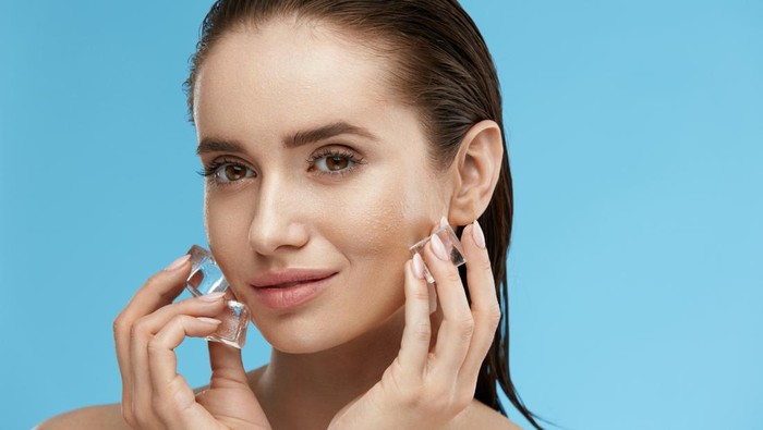 Beauty Treatment. Woman With Ice Cubes. Beautiful Girl Using Ice On Skin. High Quality