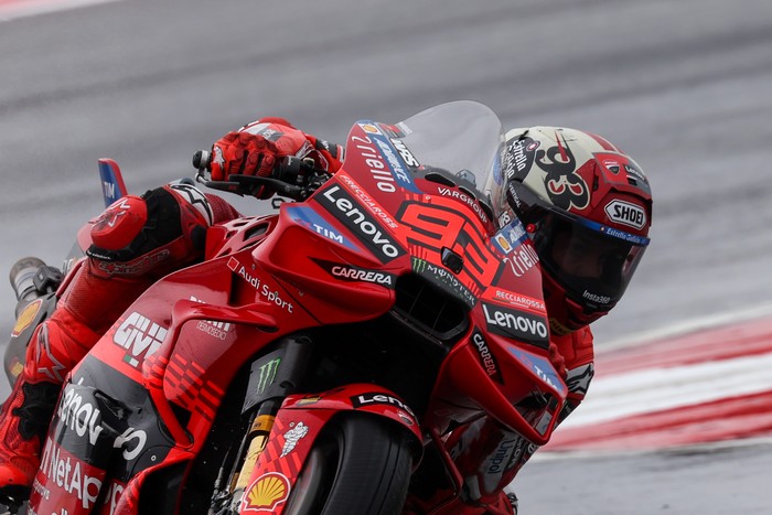 AUSTIN, TX - MARCH 28: Marc Marquez (93) of Spain and Ducati Lenovo Team speeds through turn 15 on a rain soaked track during Free Practice 1 of the MotoGP Red Bull Grand Prix of the Americas on March 28, 2025, at Circuit of The Americas in Austin, Texas. (Photo by David Buono/Icon Sportswire via Getty Images)